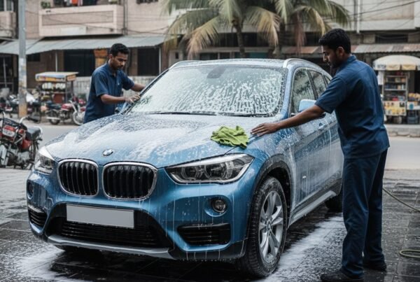 BMW X1 premium compact SUV getting full car cleaning and detailing service, including foam wash, waxing, and interior detailing for a showroom finish.
