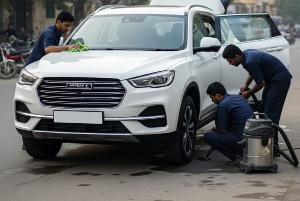 Haval H6 SUV car cleaning and detailing service in Karachi with technicians performing exterior polishing and interior vacuuming for a spotless finish.