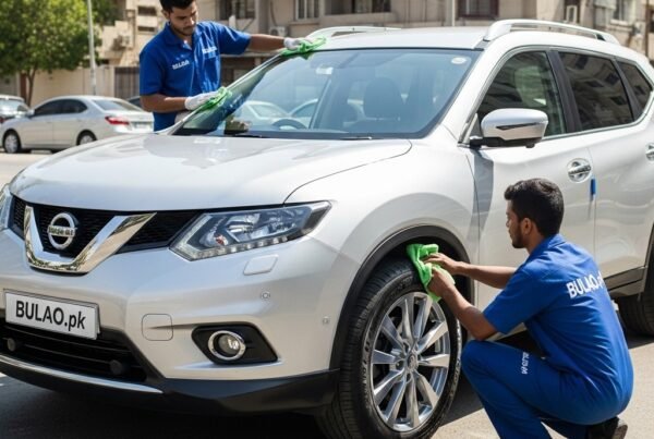Hyper-realistic image of a silver Nissan X-Trail SUV being cleaned by two Bulao.pk technicians on a sunlit Karachi street. One technician polishes the hood and panels while the other cleans the wheels. The number plate is blank and no gates are visible.