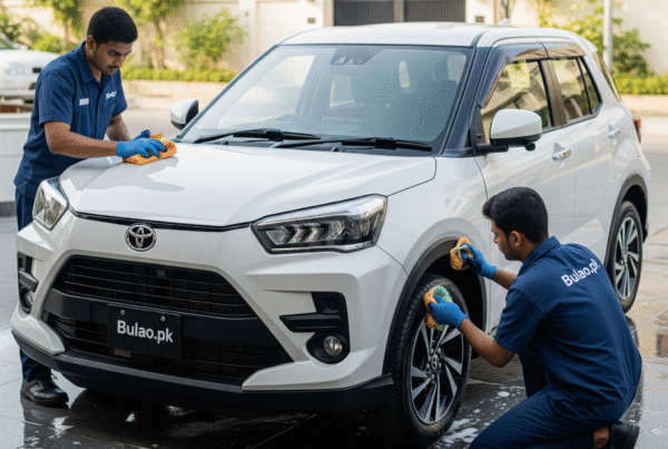 Toyota Raize receiving professional detailing service by Bulao.pk in Karachi, with technicians polishing the hood and cleaning the wheels